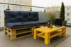 A balcony setting with a pallet sofa and coffee table. Produktbild-Vorschau