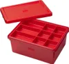 A red LEGO storage box with a lid, shown open with internal compartments. Produktbild-Vorschau