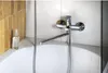 A close-up view of a bathtub faucet and the edge of a bathtub. Náhľad obrázku produktu