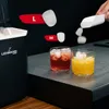 An ice maker with ice cubes being added to drinks. Podgląd zdjęcia produktu