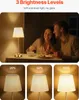 A couple dining at a table with a lamp, and three close-ups of the lamp at different brightness levels. Produktbild-Vorschau