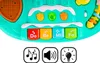 A close-up view of a toy piano keyboard with colorful buttons and icons. Podgląd zdjęcia produktu
