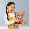 A young girl is holding a teddy bear. Podgląd zdjęcia produktu