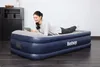 A woman is lying on an air mattress and using a tablet. Náhled obrázku produktu