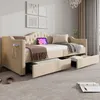 A tufted beige daybed with pull-out drawers is shown in a well-lit room. Anteprima dell’immagine prodotto