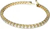 A close-up shot of a gold tennis bracelet with clear stones against a white background. Anteprima dell’immagine prodotto