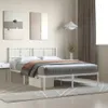 A white metal bed frame with a headboard, mattress, and bedding in a bedroom setting. Náhled obrázku produktu