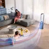 A living room scene with a fan, a woman on a couch, and a child playing on a rug. Podgląd zdjęcia produktu