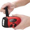 Hands holding a red and black multi-function emergency radio with a hand crank. Produktbild-Vorschau