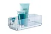 A clear acrylic shower caddy with two tubes of toiletries inside, mounted on a white background. Produktbild-Vorschau