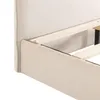 Close-up view of the side and corner of a bed frame, showing the upholstered side panel and the wooden slats of the bed base. Produktbild-Vorschau