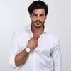 A man wearing a white shirt and a watch. Produktbild-Vorschau