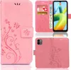 A collage of images showing a pink phone case with a floral and butterfly design, including a view of the case open with cards inserted and a phone inside, and a view of the back of the case. Produktbild-Vorschau