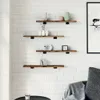 Shelves with decorative items on a white brick wall. Anteprima dell’immagine prodotto