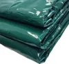 A close-up view of folded green PVC material. Produktbild-Vorschau