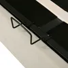 A close-up view of a bed frame's metal support structure and a fabric upholstered side. Produktbild-Vorschau
