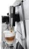 A close-up shot of a coffee machine dispensing a latte into a glass. Produktbild-Vorschau