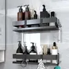 Two black bathroom shelves mounted on a tiled wall, filled with various toiletries and accessories. Anteprima dell’immagine prodotto
