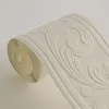 A roll of wallpaper border with an embossed floral pattern. Náhľad obrázku produktu