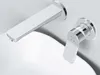 A close-up view of a modern chrome faucet and handle mounted on a white sink. Produktbild-Vorschau