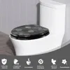 A toilet with a decorative toilet seat in a bathroom setting. Produktbild-Vorschau
