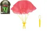 A toy parachute with a soldier figure, shown with its packaging and a separate accessory. Voir les images du produit