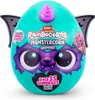 A teal egg-shaped toy with a purple monster face and wings, featuring text and branding. Produktbild-Vorschau