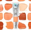 A tube of IT Cosmetics CC+ Cream foundation is shown surrounded by swatches of different shades of the product. Produktbild-Vorschau