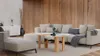 A modern living room with a sectional sofa, coffee table, and decorative elements. Podgląd zdjęcia produktu