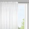 A white sheer curtain hangs in front of a window with a grid pattern. Produktbild-Vorschau