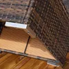 A close-up view of the corner of a polyrattan lounge set, showing the woven texture and metal corner brackets, resting on a wooden deck. Náhled obrázku produktu