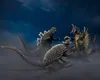 Three kaiju figures are in a dynamic battle pose amidst a smoky, dark environment. Náhled obrázku produktu
