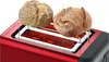 A red toaster with two bread rolls on a warming rack. Voir les images du produit