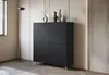 A black cabinet with a diamond pattern is shown in a room with a floor lamp and decorative vases on top. Voir les images du produit