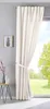 A cream-colored curtain is tied back with a fabric band, revealing a window with a green outdoor scene. A small side table with decorative items is to the left. Produktbild-Vorschau