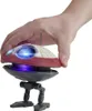 A hand holding a small, round robot with legs and lights. Anteprima dell’immagine prodotto