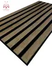 A close-up, angled view of a wall panel with alternating wooden and black slats. Náhľad obrázku produktu