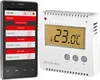 A smartphone displaying a thermostat app is shown next to a white WLAN thermostat. Podgląd zdjęcia produktu