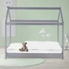 A child's bed with a house-like frame, a mattress, bedding, and a teddy bear. Náhled obrázku produktu