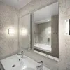 A modern bathroom with a sink and a large mirror. Produktbild-Vorschau