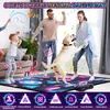 A family and their dog are dancing on a musical dance mat in a living room. Produktbild-Vorschau