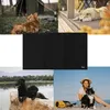 A collage of four lifestyle images featuring dogs and a cat, surrounding a central black product. Produktbild-Vorschau