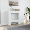 A white fireplace surround is shown in a room with a painting above it and a plant to the side. Anteprima dell’immagine prodotto