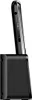 A side view of a black mobile phone docked in its charging base. Podgląd zdjęcia produktu