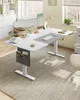 A modern office setup with a height-adjustable desk, office supplies, and a window view. Produktbild-Vorschau