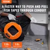 A person wearing gloves is using a fish tape to pull wires through a conduit. Produktbild-Vorschau