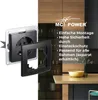 A close-up of a black electrical socket with a detached frame, set against a blurred background of a modern kitchen. Produktbild-Vorschau