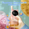 A pink cat-shaped walkie-talkie is held in a hand, with decorative elements like musical notes and colorful balls around it. The background is a soft, pastel-colored scene. Produktbild-Vorschau