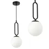 Two black pendant lights with white opal glass globes are shown against a white background. Náhled obrázku produktu
