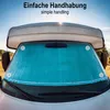 A sunshade is installed on the windshield of a campervan. Produktbild-Vorschau